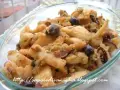 Deliziosi seppie gratinate al forno, croccanti e saporite, con olive nere e prezzemolo.